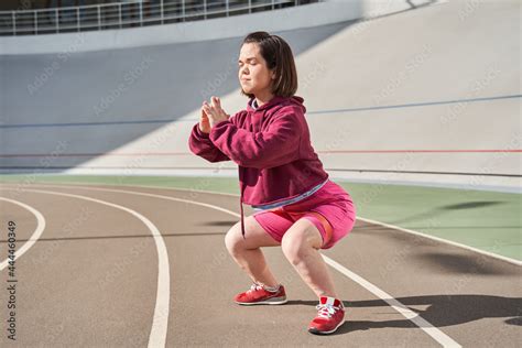 Midget Girl With Perfect Body Practicing Squats With Elastic Bands Midget Girl With Perfect Body Practicing Squats With Elastic Bands