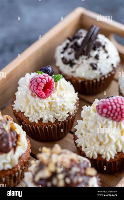 Tasty Sweet Muffins With Mascarpone Creme And Chocolate Raspberry And Tasty Sweet Muffins With Mascarpone Creme And Chocolate Raspberry And